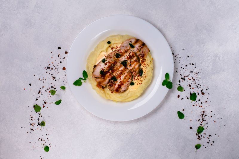 Chicken fillet with mashed potatoes and cheese sauce