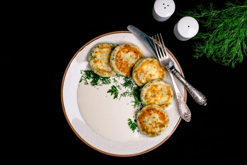 Syrnyky ( cheese pancakes) with garlic and herbs